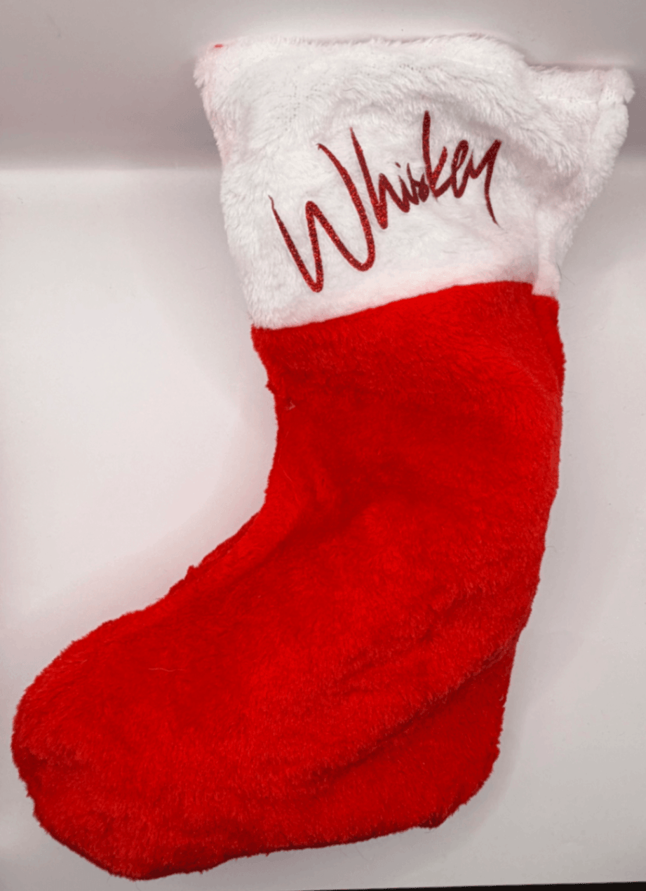 Red and white personalised Fur Baby Christmas stocking with red name lettering