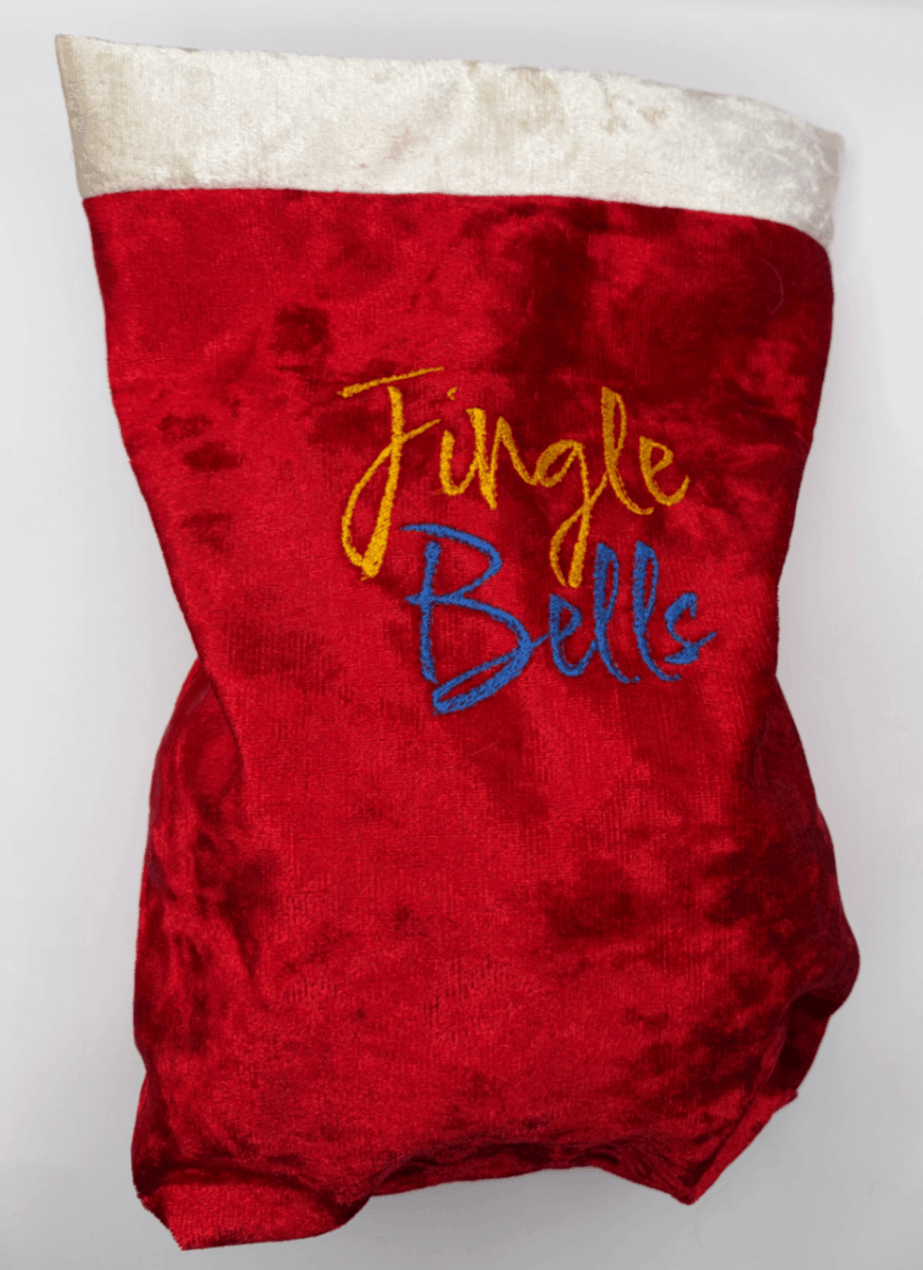 Front view of a red velvet Fur Baby Santa Sack with Jingle Bells design