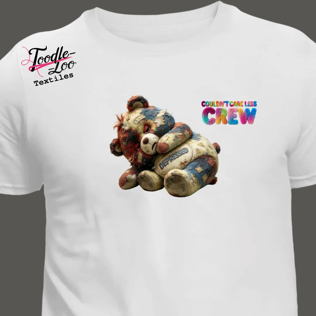 Depressed bear design on a white tee — Couldn’t Care Less Crew DTF print, shown as an AI mock-up
