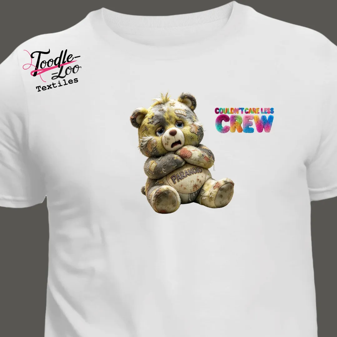 Paranoid bear design on a white tee — Couldn’t Care Less Crew DTF print, shown as an AI mock-up
