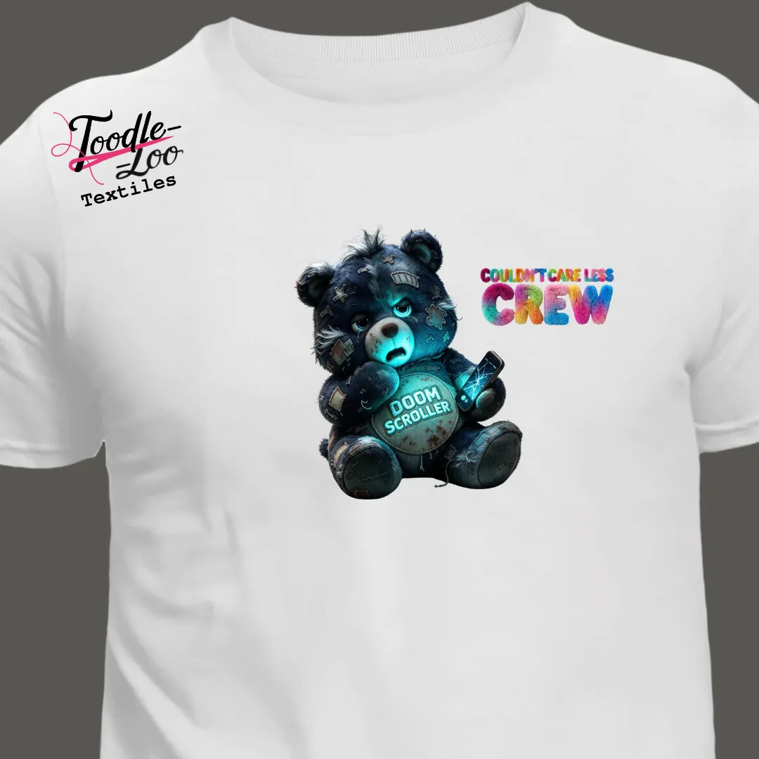 Doom Scroller v2 bear design on a white tee — Couldn’t Care Less Crew DTF print, shown as an AI mock-up