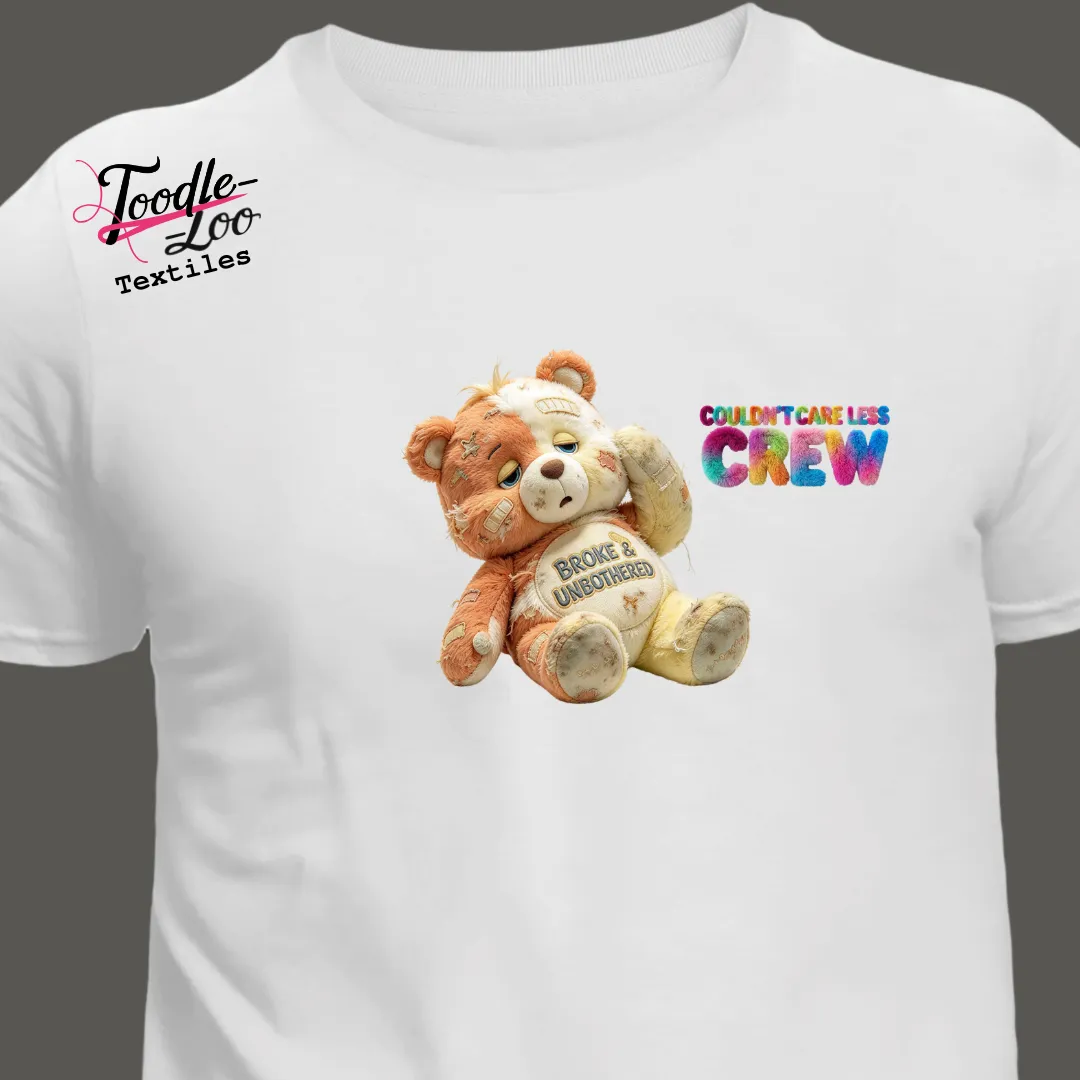 Broke and Unbothered bear design on a white tee — Couldn’t Care Less Crew DTF print, shown as an AI mock-up