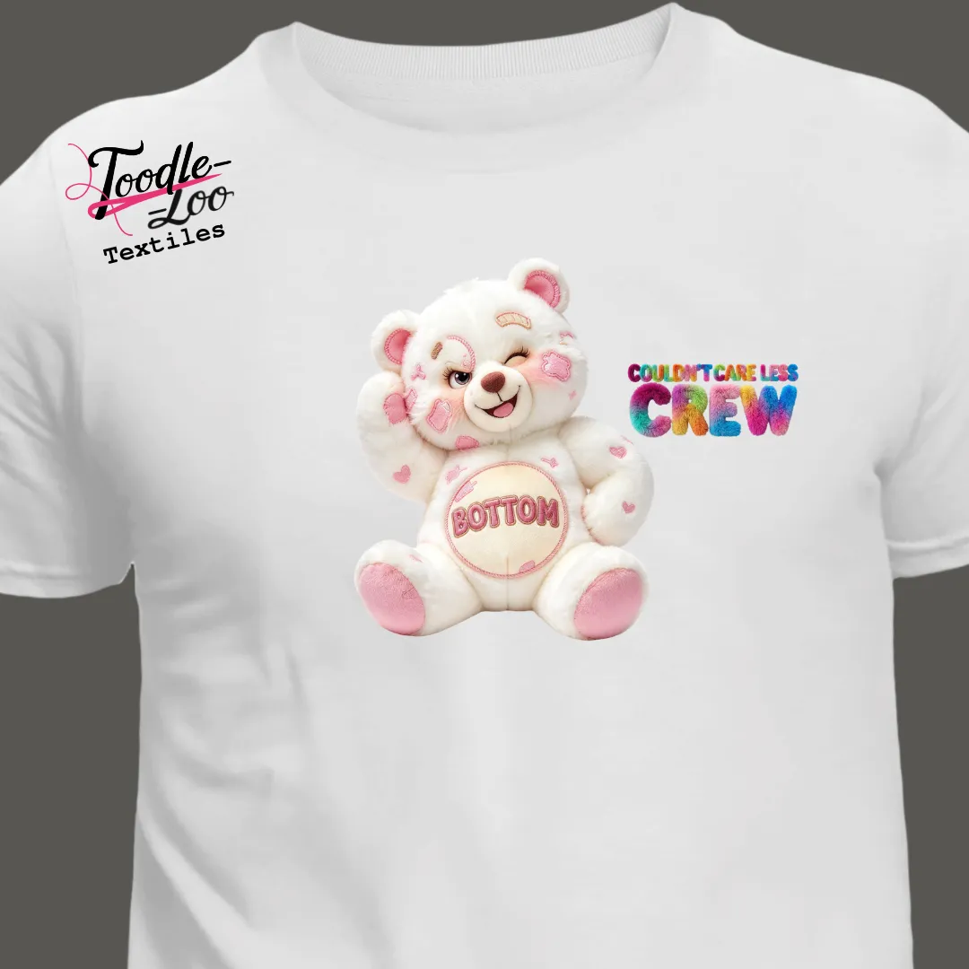 Bottom bear design, sitting, on a white tee — Couldn’t Care Less Crew DTF print, shown as an AI mock-up
